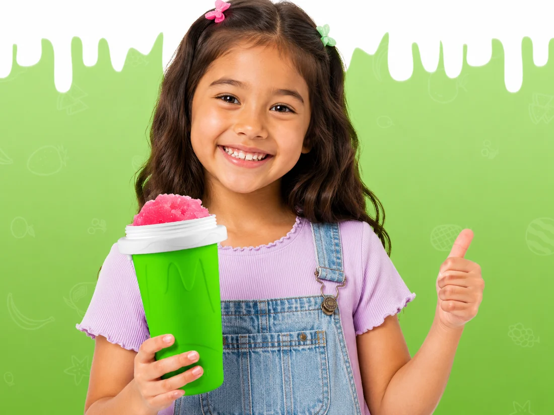 Happy kid holding a green Pocket Slushy cup filled with pink frozen slushy